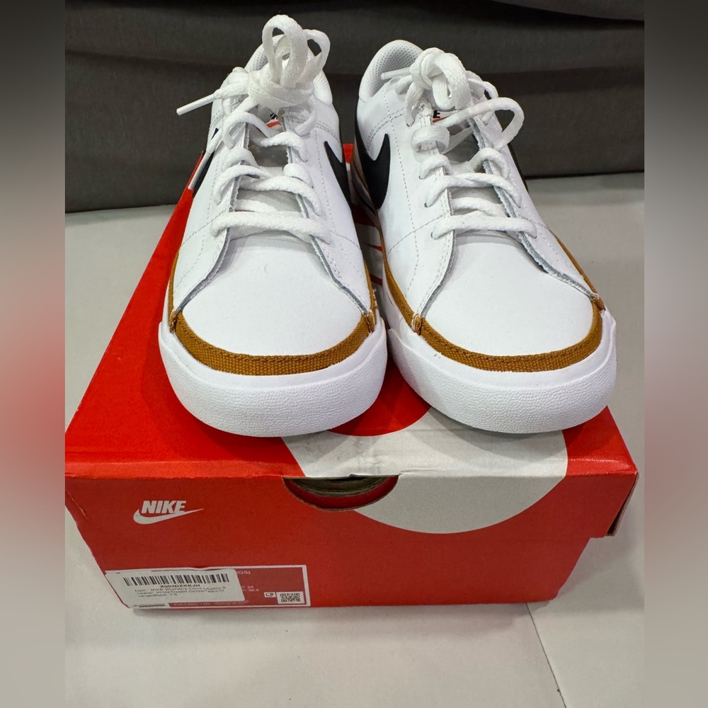 Nike White Sneakers with Black Swoosh and Brown Accent